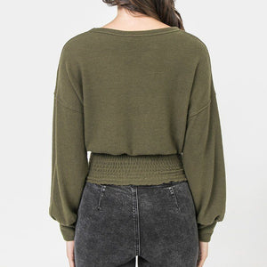 A Knit Top Featuring Wide Neckline