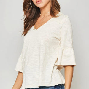 A Knit Top With Deep V Neckline And Yoke Design