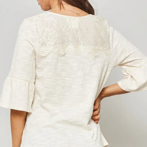 A Knit Top With Deep V Neckline And Yoke Design